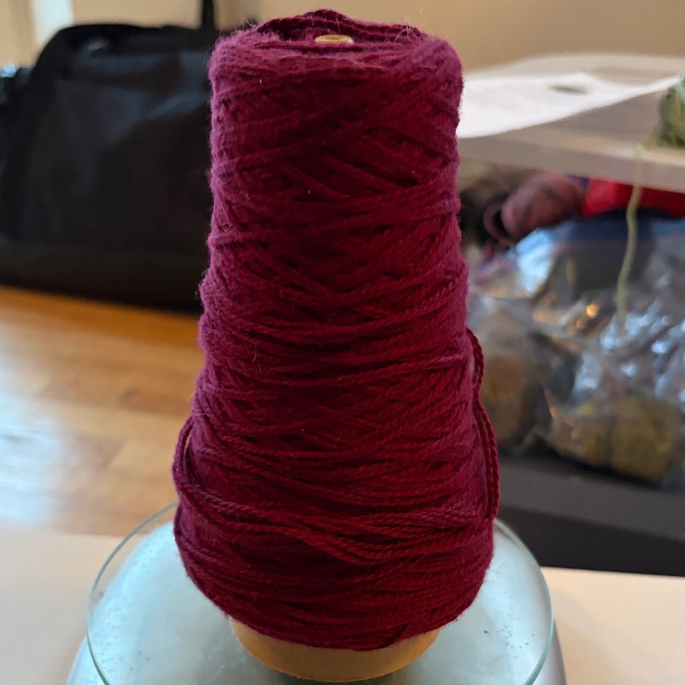 Burgundy yarn on cone 100% cotton